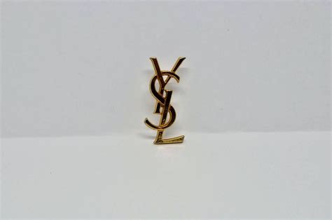 broche epingle yves saint laurent|BROOCHES AND RINGS .